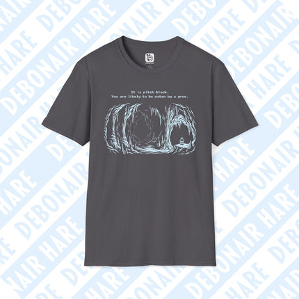 A gray t-shirt with an image of a lonely cave and the text "It is pitch black. You are likely to be eaten by a grue."