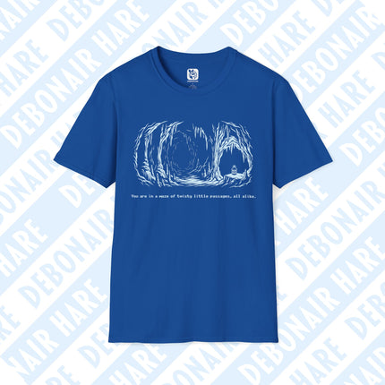 A bright blue tshirt depicting a lonely cave with a single lantern, with the text "You are in a maze of twisty little passages, all alike."