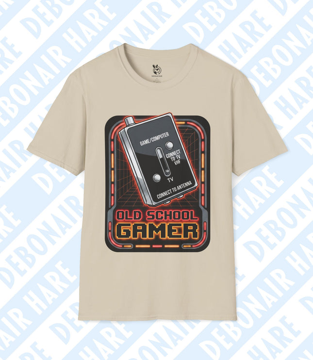 A light beige t-shirt with an Old School Gamer graphic featuring an old TV adapter switch.