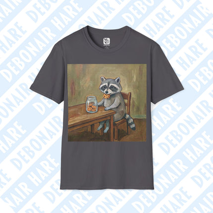 Gray t-shirt depicting a raccoon sitting at a table eating a cookie