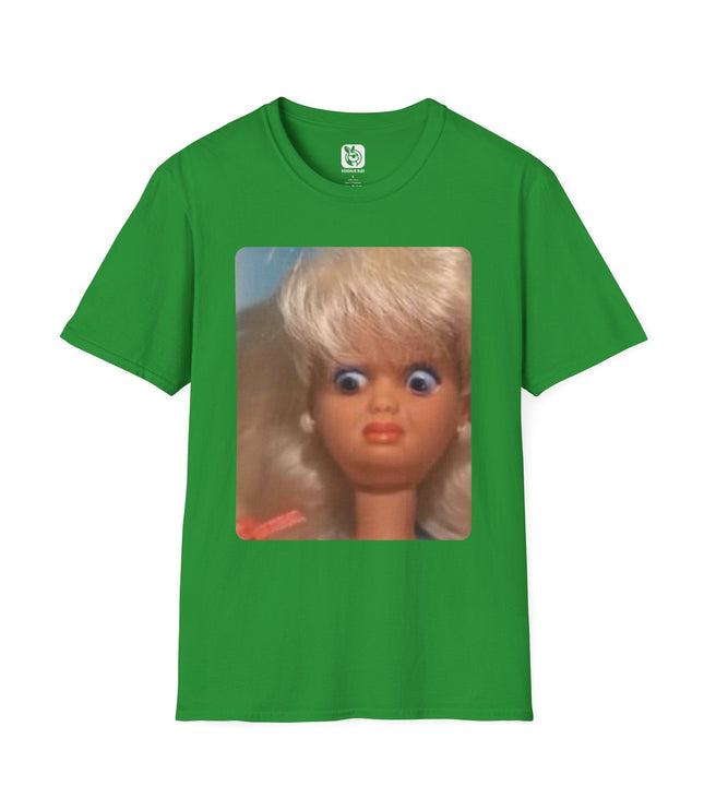Green t-shirt with a graphic of a doll's face with a disgusted expression