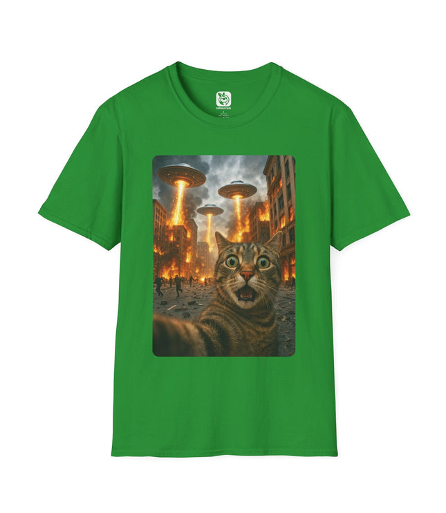 Green t-shirt with a graphic of a cat and UFOs on a cityscape