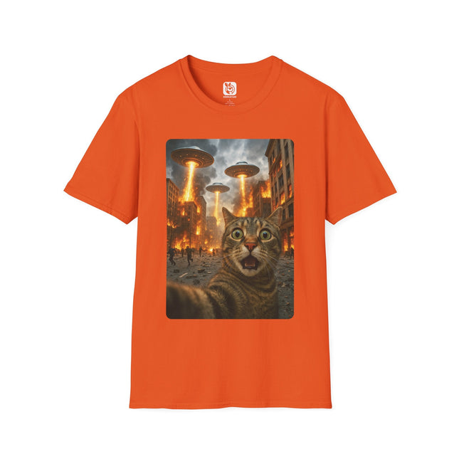 Orange t-shirt with a graphic of a cat and alien saucers on a cityscape