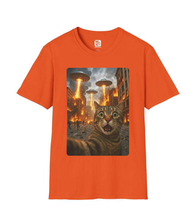 Orange t-shirt with a graphic of a cat and alien saucers on a cityscape