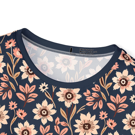 The neck of a soft polyester sports jersey featuring a flat floral design pattern of pale beige flowers on blue.