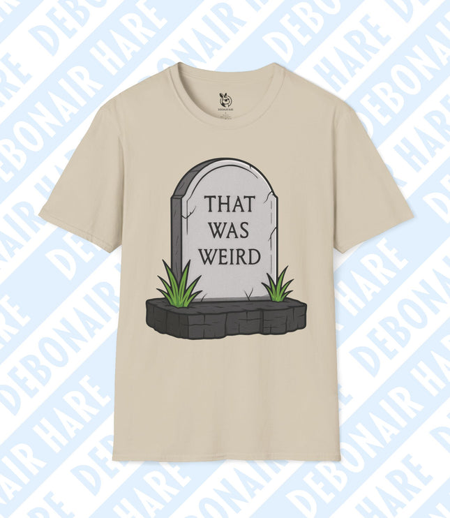 A beige t-shirt depicting a gravestone that says "That was weird"