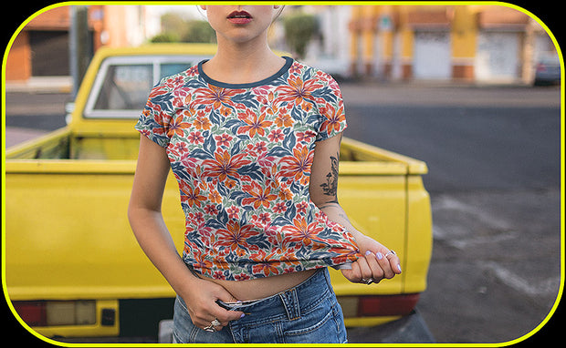 Person wearing a colorful floral-patterned shirt in front of a yellow truck.